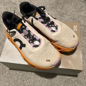 On Running Cream and Orange Athletic Shoes